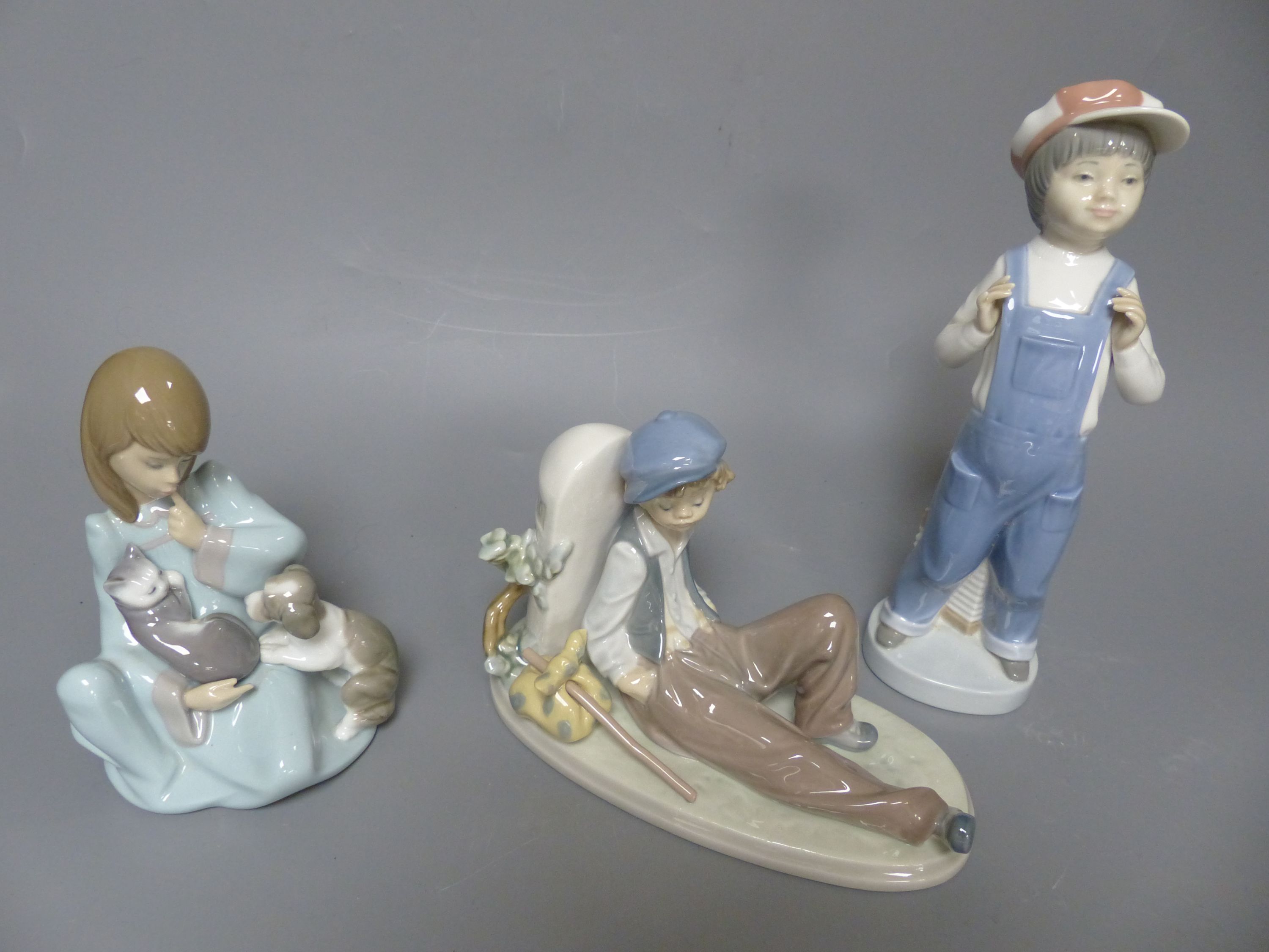 Fourteen Lladro figures of children